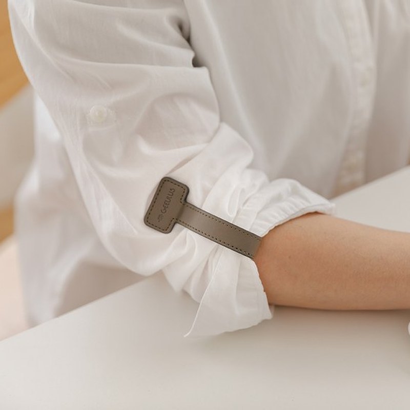 Sleeve holder worn with white shirt